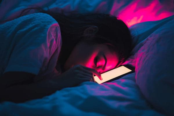 Youth sleeping with phone