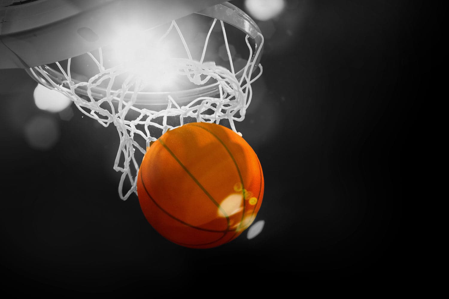 Basketball going through hoop